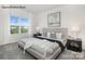 This bedroom features a large window providing natural light and a neutral color palette, creating a cozy and inviting atmosphere at 7913 Old Brook Dr, Sherrills Ford, NC 28673