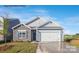 Inviting single-Gathering home with stone details, a two-car garage, and well-maintained landscaping at 7913 Old Brook Dr, Sherrills Ford, NC 28673