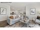 Bright living room flows into a modern kitchen, showcasing an open-concept design and stylish furnishings at 7913 Old Brook Dr, Sherrills Ford, NC 28673