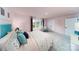 Inviting bedroom with pink walls, a queen bed, and a cozy reading chair by the window at 8004 Plymouth Dr, Sherrills Ford, NC 28673