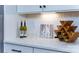 Countertop with decorative items like wine bottles and a Lake Norman print at 8004 Plymouth Dr, Sherrills Ford, NC 28673