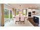 Bright dining room with sleek hardwood floors and an elegant light fixture above the table at 8004 Plymouth Dr, Sherrills Ford, NC 28673