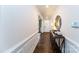 Elegant hallway features wood floors, decorative table, and an inviting ambiance at 8004 Plymouth Dr, Sherrills Ford, NC 28673