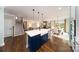 Open-concept kitchen showcases an island, and seamless flow to the living spaces at 8004 Plymouth Dr, Sherrills Ford, NC 28673