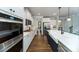 Modern kitchen features stainless steel appliances, a large island, and hardwood floors at 8004 Plymouth Dr, Sherrills Ford, NC 28673