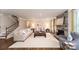 Bright living room features a stone fireplace, neutral décor, and comfortable seating arrangement at 8004 Plymouth Dr, Sherrills Ford, NC 28673