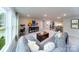 Open recreation room with comfortable seating, natural light, and staircase view at 8004 Plymouth Dr, Sherrills Ford, NC 28673