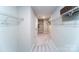 Spacious walk-in closet with carpeted floors and wire shelving provides ample storage at 8004 Plymouth Dr, Sherrills Ford, NC 28673