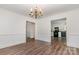 Bright dining room with wood-look floors and access to the kitchen at 8429 Meadowcroft Ct, Charlotte, NC 28215