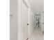 Bright hallway with white walls, marble flooring, and multiple doors leading to various rooms at 8429 Meadowcroft Ct, Charlotte, NC 28215