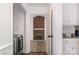 View into living room featuring a brick fireplace with a wood-look floor at 8429 Meadowcroft Ct, Charlotte, NC 28215
