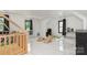 Bright playroom with white walls and marble floors, complete with natural wooden play structures at 8429 Meadowcroft Ct, Charlotte, NC 28215