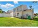 A spacious backyard, featuring a concrete patio, with grass, and the house exterior at 8605 Sawleaf Ct, Charlotte, NC 28215