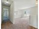 Bright, open bonus room with large windows and neutral carpet, great for flexible living at 8605 Sawleaf Ct, Charlotte, NC 28215