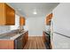 Spacious kitchen layout with stainless steel appliances, granite countertops, and natural wood cabinets at 8605 Sawleaf Ct, Charlotte, NC 28215