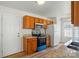 Bright kitchen featuring wood cabinets, granite countertops, and stainless steel appliances at 8605 Sawleaf Ct, Charlotte, NC 28215
