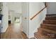 Spacious living room with a fireplace, wood floors, and access to a backyard at 8605 Sawleaf Ct, Charlotte, NC 28215