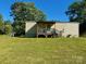 Spacious backyard with a covered deck and plenty of room for outdoor activities at 8827 Spring Meadow Dr, Hickory, NC 28601