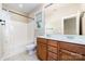 Bathroom featuring a double vanity, tiled floors, and a shower-tub combo at 939 White Point Dr, Huntersville, NC 28078