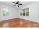 Light-filled bedroom with hardwood floors and large windows at 939 White Point Dr, Huntersville, NC 28078