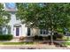 Charming townhomes with vibrant exteriors, neatly trimmed shrubs, and mature shade trees at 939 White Point Dr, Huntersville, NC 28078