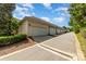 A row of garages with neutral siding along an asphalt paved road at 939 White Point Dr, Huntersville, NC 28078