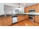 Open kitchen with granite countertops, stainless steel appliances and hardwood flooring at 939 White Point Dr, Huntersville, NC 28078