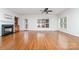 Living room featuring hardwood floors, a fireplace, and plenty of natural light at 939 White Point Dr, Huntersville, NC 28078