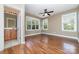 Main bedroom suite featuring wood floors, neutral walls, large windows, and attached bath at 939 White Point Dr, Huntersville, NC 28078