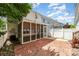 Backyard patio with a screened-in porch, string lights, and a charming yard at 939 White Point Dr, Huntersville, NC 28078