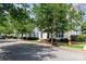Inviting neighborhood street view showcasing well-maintained townhomes and landscaping at 939 White Point Dr, Huntersville, NC 28078