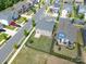An aerial view of houses in a suburban neighborhood, with small, well-maintained yards and paved streets at 1004 Earlston Rd, Indian Trail, NC 28079