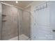 Bathroom featuring a walk-in shower with tile surround and a convenient coat rack at 1004 Earlston Rd, Indian Trail, NC 28079
