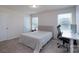 Cozy bedroom with neutral carpet, desk, chair, and bright windows, perfect for guests at 1004 Earlston Rd, Indian Trail, NC 28079