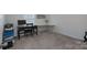 Simple bedroom with modern decor, a comfortable desk, and a large window for natural light at 1004 Earlston Rd, Indian Trail, NC 28079
