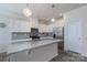 Modern kitchen with granite countertops, stainless steel appliances, and ample cabinet space at 1004 Earlston Rd, Indian Trail, NC 28079