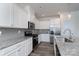 Stylish kitchen with granite countertops, stainless steel appliances, and white cabinetry at 1004 Earlston Rd, Indian Trail, NC 28079