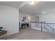 Open loft area with neutral walls, carpet flooring, a piano, and natural light from windows at 1004 Earlston Rd, Indian Trail, NC 28079
