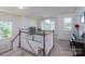 Bright loft area with carpet, white railings, neutral walls, large windows, and an entertainment area at 1004 Earlston Rd, Indian Trail, NC 28079