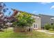 Well-kept backyard with patio, lush trees, and view of the home's rear exterior at 1020 Bannister Rd, Waxhaw, NC 28173