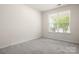 Neutral bedroom with a large window, offering great light and space at 1020 Bannister Rd, Waxhaw, NC 28173