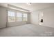 Bedroom with neutral walls, carpet, and three windows at 1020 Bannister Rd, Waxhaw, NC 28173