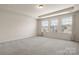 Bedroom with neutral walls, carpet, and three windows at 1020 Bannister Rd, Waxhaw, NC 28173