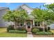 Charming home with a welcoming front porch, featuring stone accents and mature landscaping at 1020 Bannister Rd, Waxhaw, NC 28173
