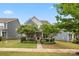 Charming two-story home with a well-manicured lawn, walkway, attractive landscaping, and a covered porch at 1020 Bannister Rd, Waxhaw, NC 28173
