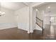 Entry hallway featuring wood floors, wainscoting, and a staircase leading upstairs at 1020 Bannister Rd, Waxhaw, NC 28173
