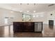Modern kitchen island with granite countertops, stainless steel dishwasher, and pendant lighting at 1020 Bannister Rd, Waxhaw, NC 28173
