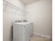 Laundry room with a washer and dryer and metal shelving at 1020 Bannister Rd, Waxhaw, NC 28173