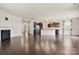 Open floor plan showcasing the living area with dark wood flooring and fireplace at 1020 Bannister Rd, Waxhaw, NC 28173