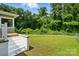 A well maintained lawn leading up to a wooded area at 1038 Blake Rd, Albemarle, NC 28001
